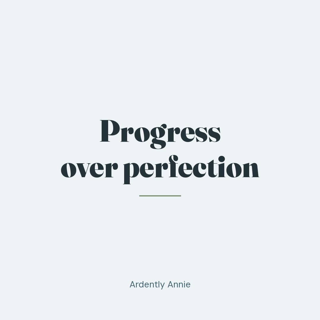 The words "Progress over perfection" on a soft mist background.