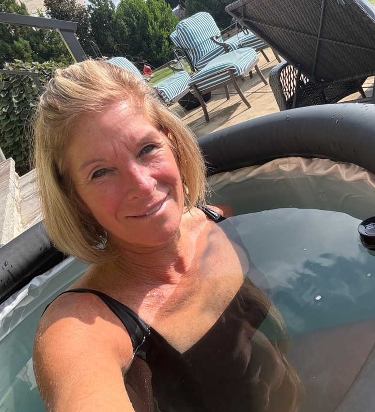 Annie smiling in her backyard ice pod.