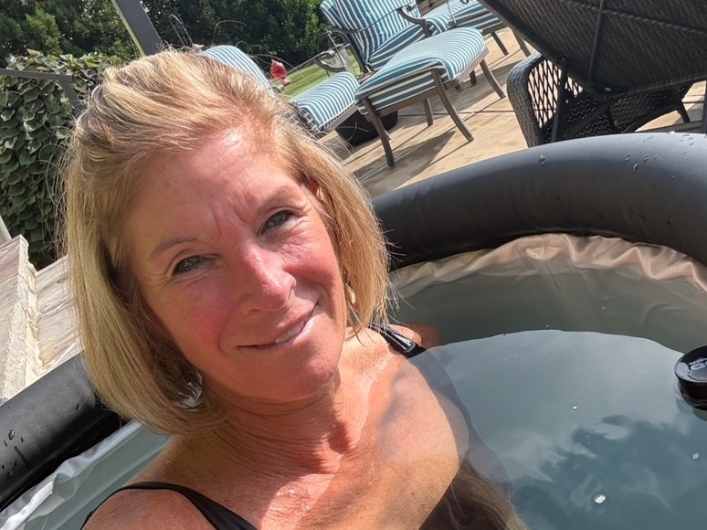Annie smiling in her backyard ice pod.